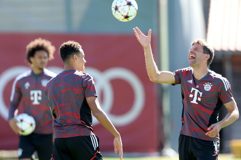 Thomas Muller throws a ball into the air during training. Getty