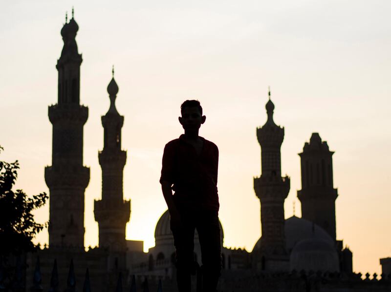 A person watches celebrations of the Mawlid at Al Hussein district, Cairo, Egypt.  EPA