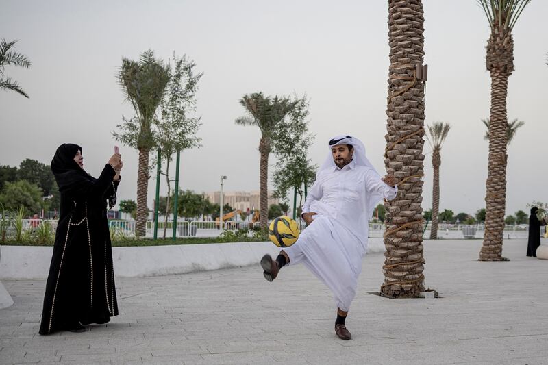 A man plays football in a park in Doha ahead of the World Cup. Reuters