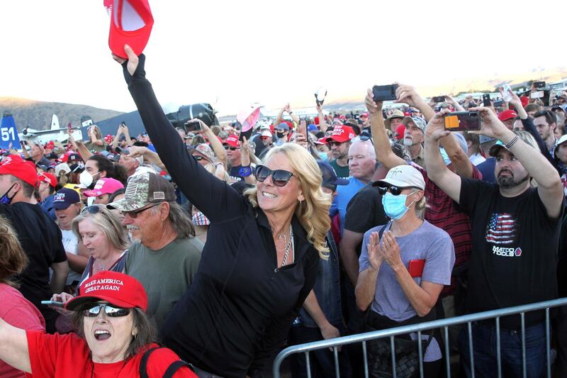 Stephennie Leach from Bethel Island, California, waves to President Donald Trump after his speech to supporters at a political rally at the Carson City. AP
