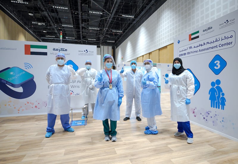 Abu Dhabi, United Arab Emirates, June 4, 2020.   
  Doctors, nurses and volunteers take time out for a photograph at the new Covid-19 Prime Assessment Center at ADNEC.
Victor Besa  / The National
Section:  NA
Reporter:  Shireena Al Nowais
