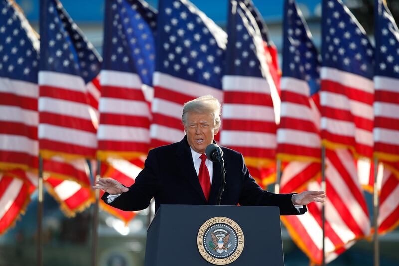 President Donald Trump speaks to crowd before boarding Air Force One at Andrews Air Force Base. AP Photo