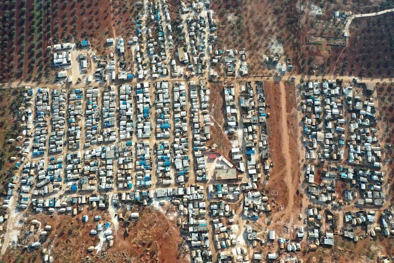 An aerial picture shows camps for displaced Syrians in the village of Killi, near Bab Al Hawa by the border with Turkey, in the northwestern Idlib province.  AFP