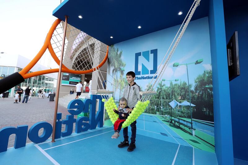 Abu Dhabi, United Arab Emirates - Reporter: Jon Turner: Fans enjoy The Nationals booth during the Mubadala World Tennis Championship. Friday, December 20th, 2019. Zayed Sports City, Abu Dhabi. Chris Whiteoak / The National