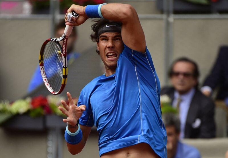 Rafael Nadal returns the ball to Argentinian Juan Monaco during their men's singles match at the Madrid Masters second round at the Caja Magica in Madrid on Wednesday. Pierre-Philippe Marcou / AFP / May 7, 2014