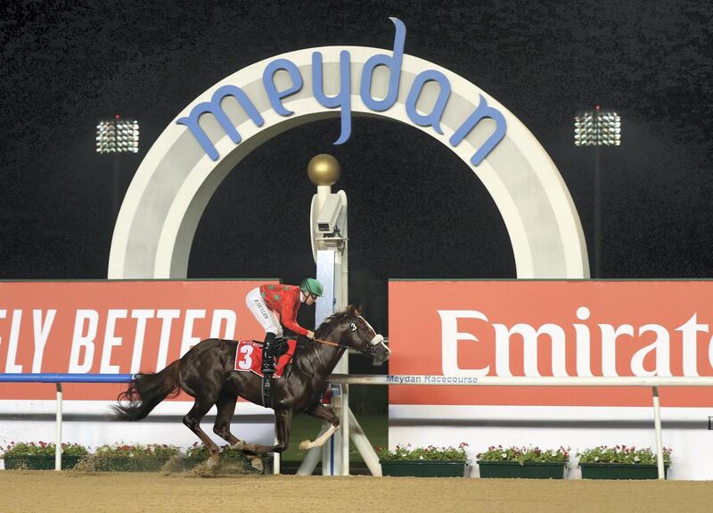 Dubai, United Arab Emirates - October 24, 2019: Barack Beach ridden by Richard Mullen wins the Emirates Holidays race on the opening meeting of the new season. Thursday the 24th of October 2019. Meydan Racecourse, Dubai. Chris Whiteoak / The National