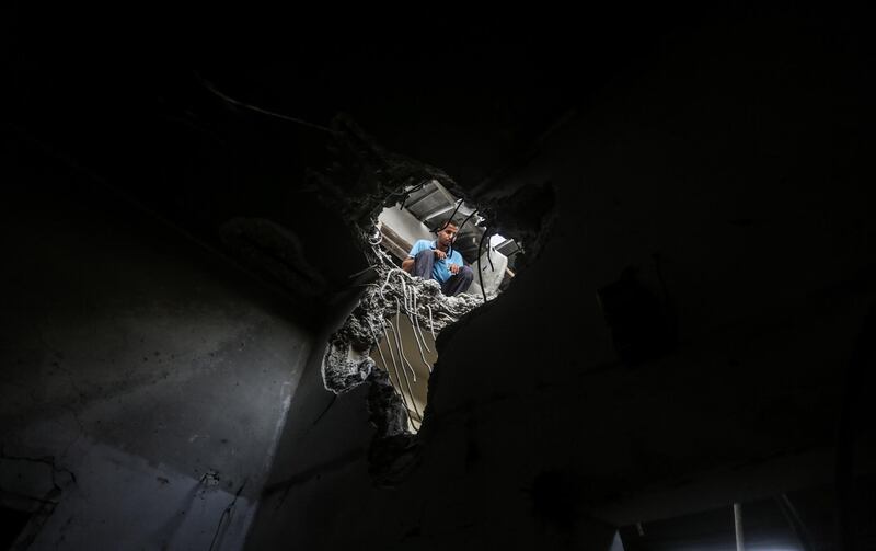 A Palestinian inspects a rubble. EPA