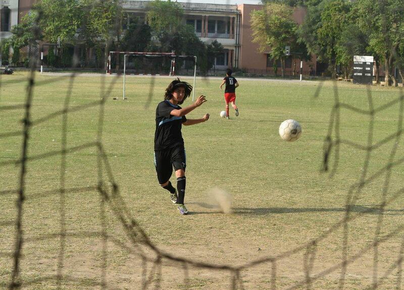 Pakistani national cricket and football  player Diana Baig takes part in a football training session at a ground in Lahore in May. Arif Ali / AFP / May 4, 2016