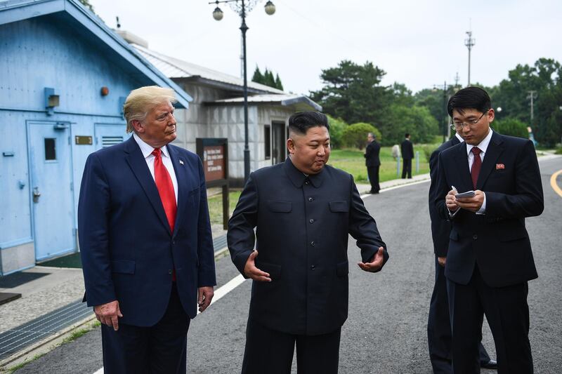 US President Donald Trump stands with North Korean leader Kim Jong-un at the demilitarised zone separating the two Koreas, in Panmunjom, South Korea. AFP