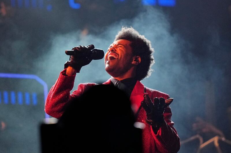 FILE - The Weeknd performs during the halftime show of the NFL Super Bowl 55 football game between the Kansas City Chiefs and Tampa Bay Buccaneers in Tampa, Fla. on Feb. 7, 2021. The Weeknd will celebrate his whopping 16 nominations at the Billboard Music Awards with a performance at the show. Dick clark productions announced that the pop star will hit the stage at the May 23 event. It will air live on NBC from the Microsoft Theater in Los Angeles. (AP Photo/David J. Phillip, File)
