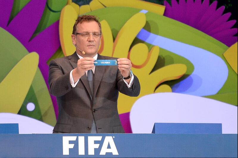 FIFA Secretary General Jerome Valcke holds up the name of Colombia during the final draw for the 2014 FIFA World Cup. Colombia has sold 60,231 tickets so far, 4 per cent of the total sold. Buda Mendes / Getty Images