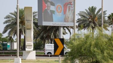 A billboard displays photos of Palestinian President Mahmoud Abbas and Bahrain's King Hamad in Manama, Bahrain, on Tuesday. Reuters