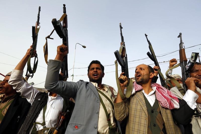Houthi supporters raise their guns aloft while shouting anti-Saudi slogans during a rally protesting airstrikes carried out by a Saudi-led coalition against Houthi rebels in Yemen. Yahya Arhab / EPA 
