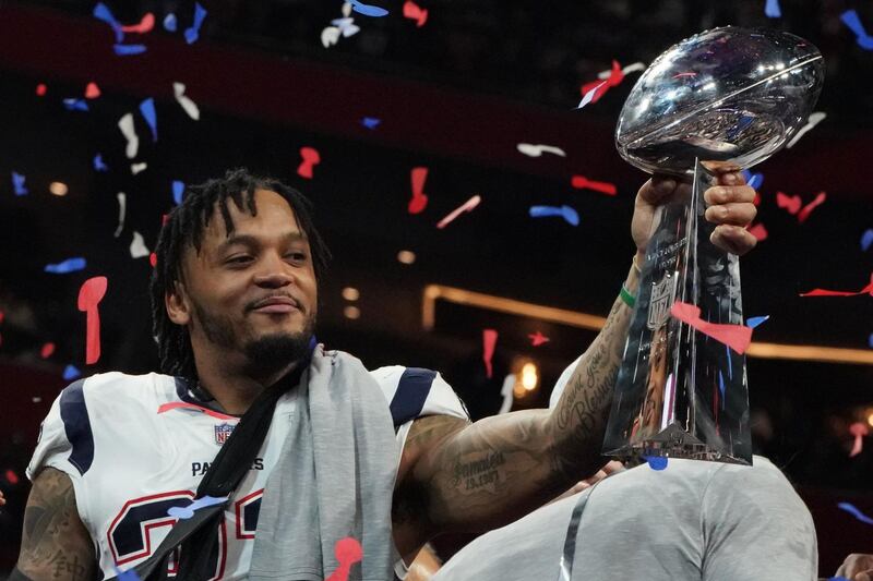 Patrick Chung of the Patriots holds the Super Bowl trophy. AFP