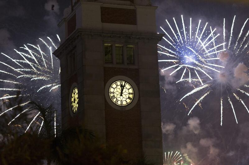 Hong Kong welcomes 2015 with fireworks behind the Clock Tower in Tsim Sha Tsui, Hong Kong, China, 31 December 2014. Jerome Favre/EPA