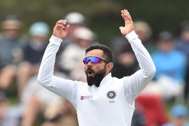 India's captain Virat Kohli reacts as he bowls on day three of the second Test cricket match between New Zealand and India at the Hagley Oval in Christchurch on March 2, 2020. / AFP / PETER PARKS