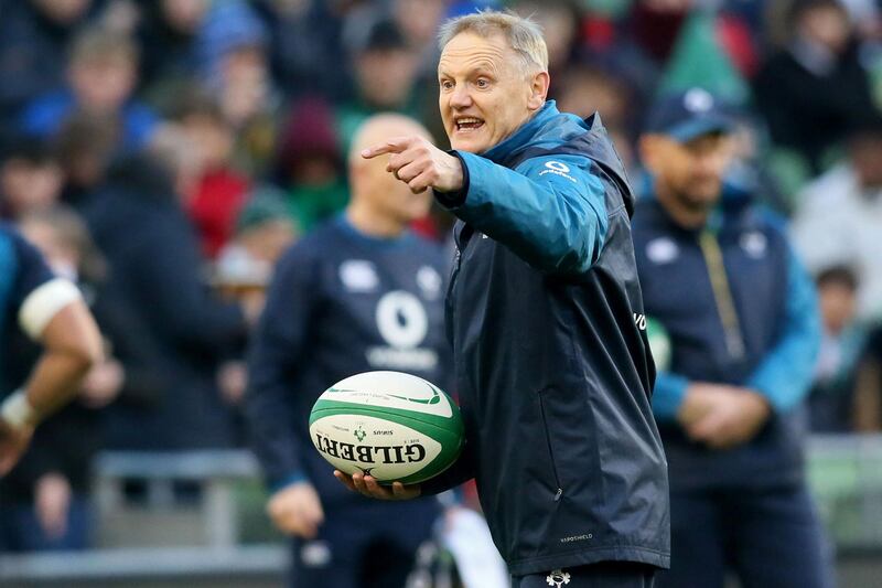 Ireland's coach Joe Schmidt gestures as his players warm up ahead of the Six Nations international rugby union match between Ireland and England at the Aviva Stadium in Dublin on February 2, 2019.   England won the game 32-20. / AFP / Paul FAITH
