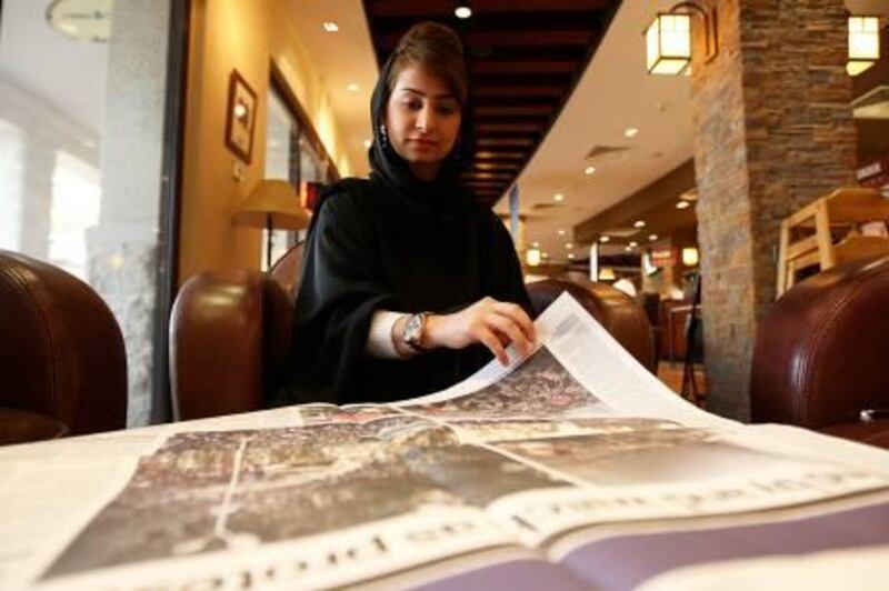 
DUBAI, UNITED ARAB EMIRATES Ð Jan 30,2011: Noura Al Ali reading news about the anti-government protest in Egypt at the coffee shop in Uptown Mirdif in Dubai. (Pawan Singh / The National) For News. Story by Haneen
