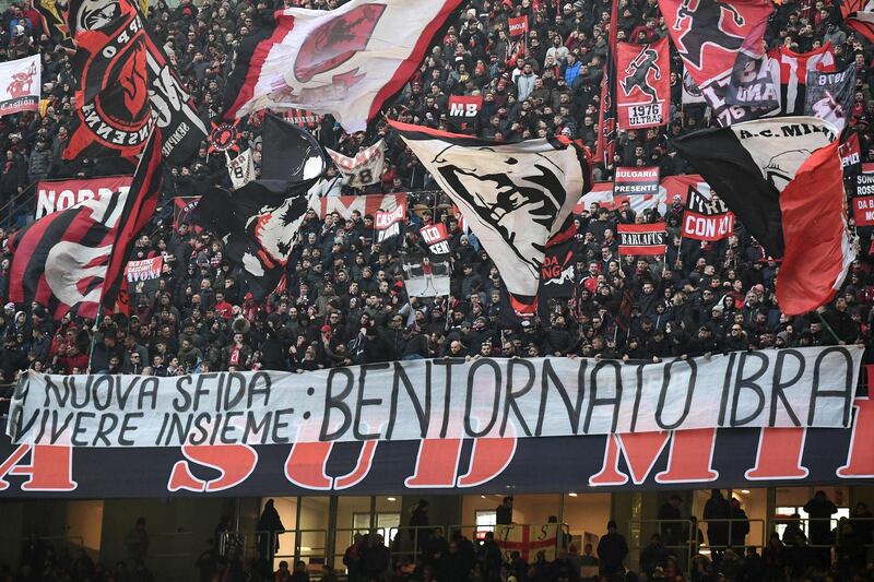 AC Milan supporters display a banner reading "Welcome back Ibra". AFP