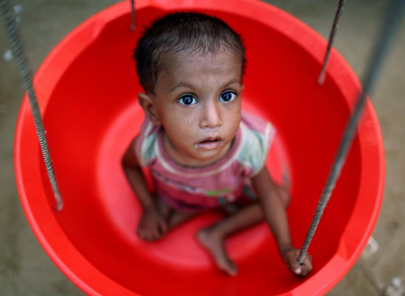 A Rohingya refugee girl is weighed at an emergency centre in Balukhali refugee camp near Cox's Bazar, Bangladesh. Navesh Chitrakar / Reuters