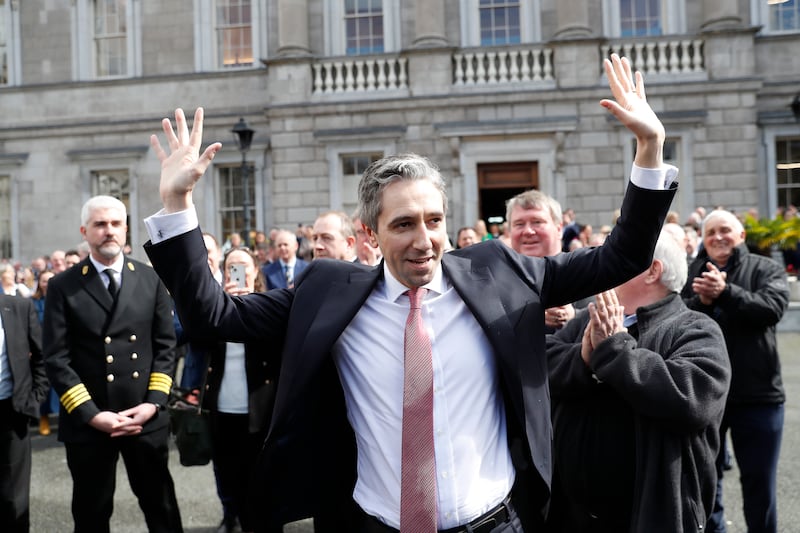 The new Prime Minister of Ireland, Simon Harris, is applauded politicians outside Leinster House in Dublin on Tuesday. AP Photo