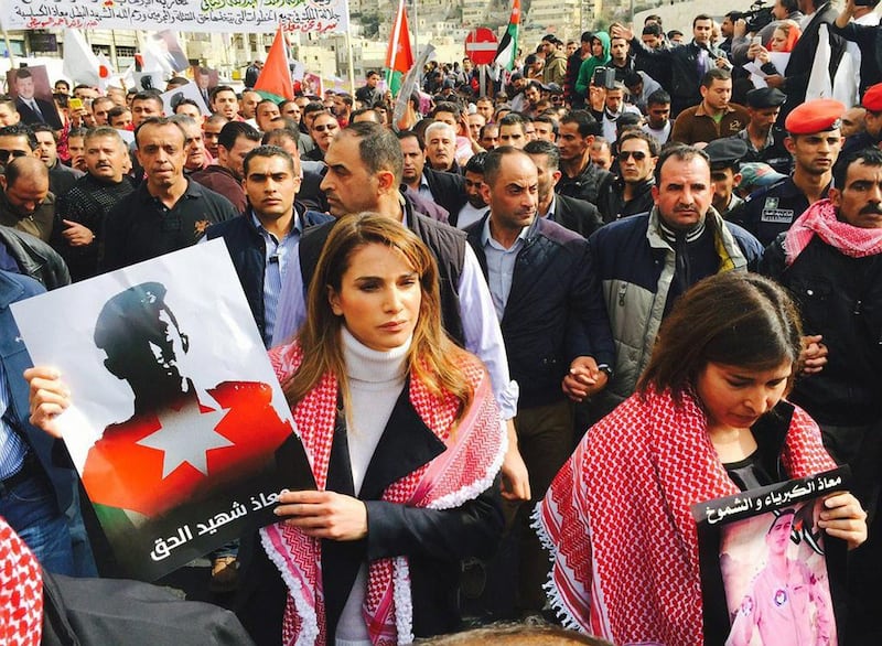 Jordan’s Queen Rania, centre, after midday prayers yesterday joined thousands of demonstrators on the streets of the Jordanian capital Amman to express their solidarity with the air force pilot burnt to death by militants. Queen Rania’s Office / AFP