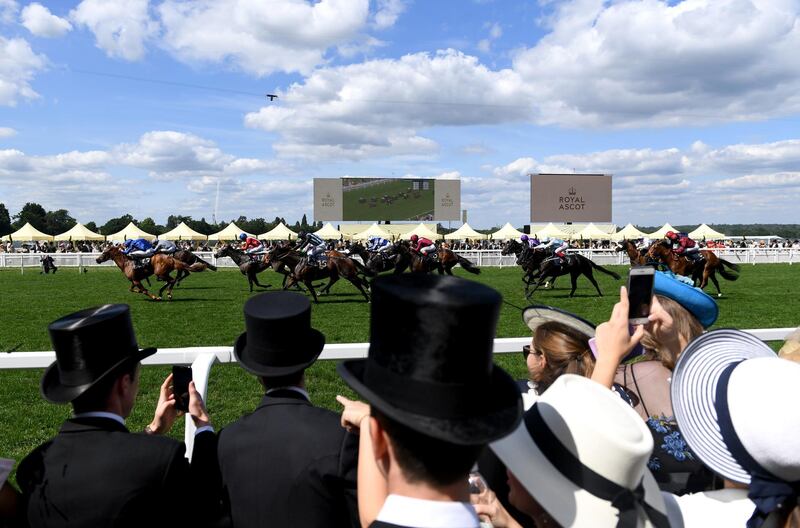 Racegoers cheer from the rails of the Royal Enclosure. Getty Images