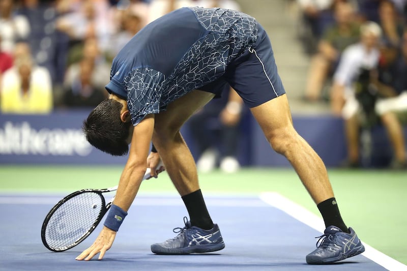 Djokovic reacts during his men's singles quarter-final match. AFP