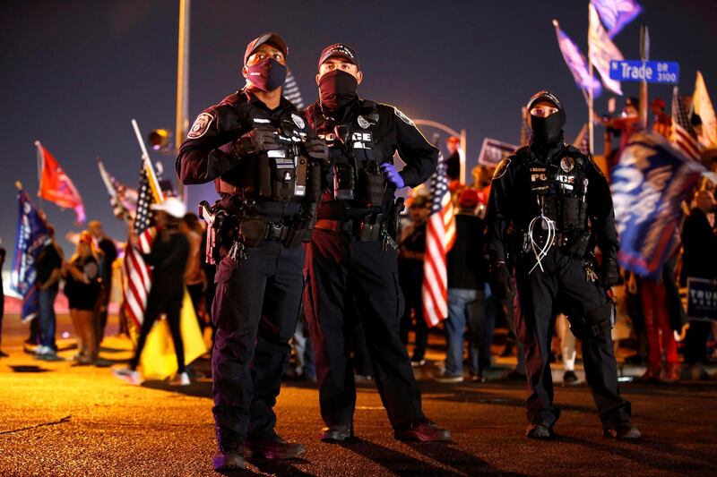 Las Vegas Police officers keep an eye on supporters of US President Donald Trump during a 'Stop the Steal' protest. Reuters