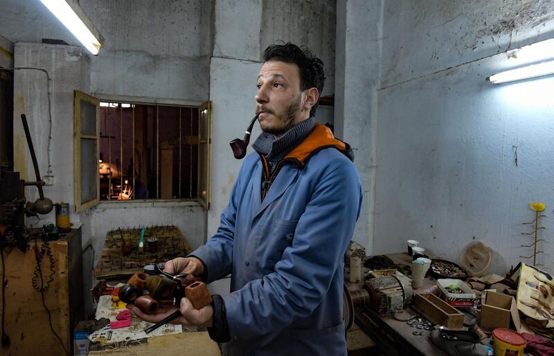 Tunisia's sole artisan pipe-maker Anis Bouchnak carves smoking pipes from native briar wood, a craft passed down by his grandfather and father. All photos by AFP