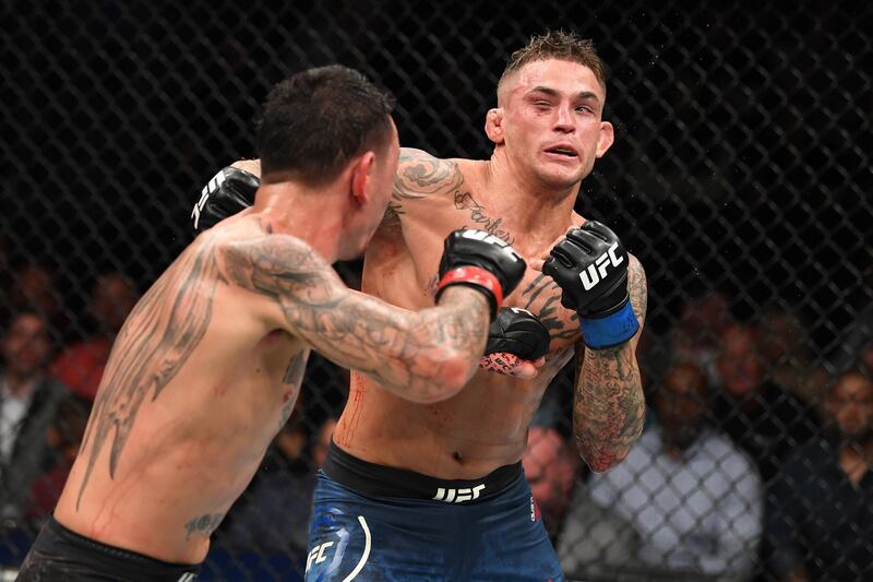 ATLANTA, GA - APRIL 13:  (L-R) Max Holloway punches Dustin Poirier in their interim lightweight championship bout during the UFC 236 event at State Farm Arena on April 13, 2019 in Atlanta, Georgia. (Photo by Josh Hedges/Zuffa LLC/Zuffa LLC via Getty Images)