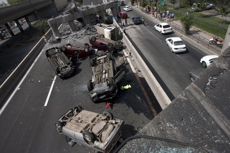 Overturned cars on a road in Santiago, Chile, after an 8.8 magnitude quake shook the country in February 2010