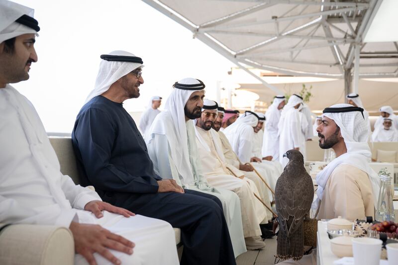 Sheikh Khalifa bin Tahnoon Al Nahyan, chairman of the Abu Dhabi Crown Prince's Court, speaks with Sheikh Mohamed, Sheikh Mohammed bin Rashid, and Sheikh Maktoum. Hamad Al Kaabi / Presidential Court