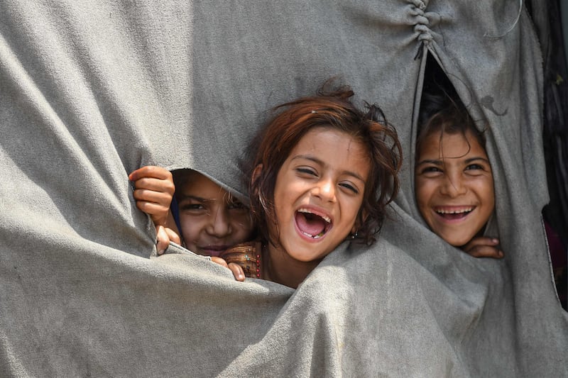 Children of Afghan refugees living on the outskirts of Lahore, Pakistan. The Mothers' Endowment campaign aims to serve the welfare of young underprivileged people. AFP