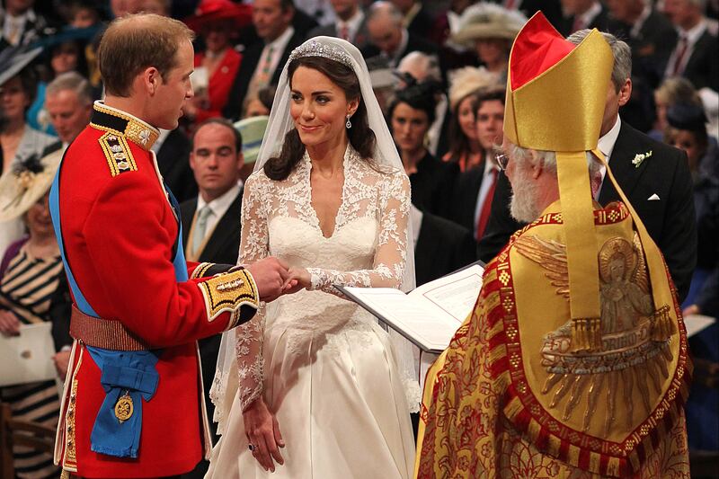 2011: Prince William exchanges rings with his bride Kate Middleton at their wedding in Westminster Abbey, London. Getty Images