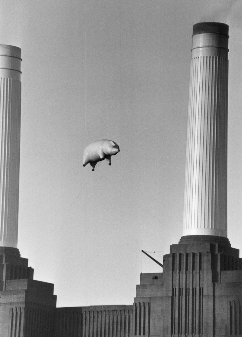 A 40-foot long inflatable pig suspended between two of the chimneys at Battersea Power Station in 1976, during a photoshoot for the cover of Pink Floyd's album 'Animals'. Getty Images