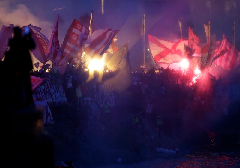 Supporters of Red Star wave flags during the SuperLiga title celebration in Belgrade. EPA