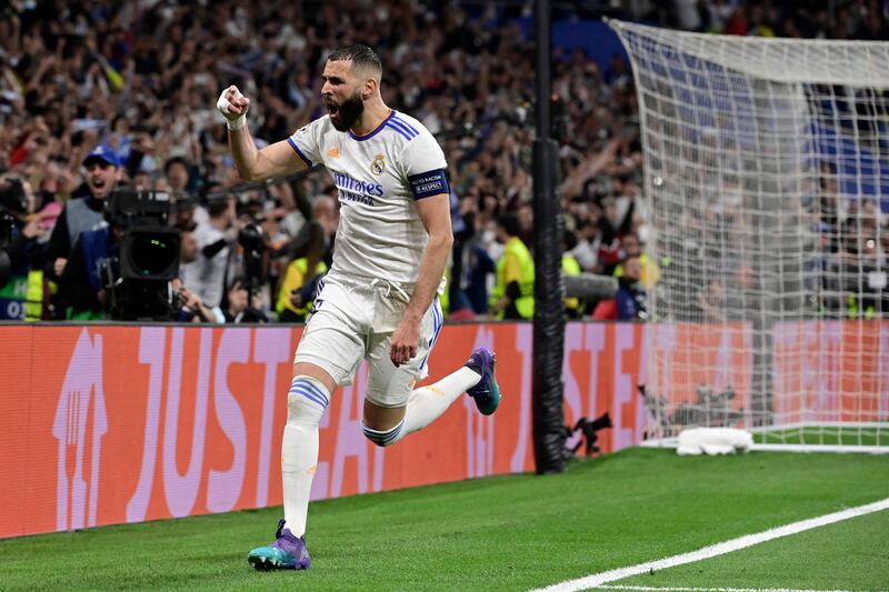 Karim Benzema celebrates scoring Real's third goal from the penalty spot and securing a place in the Champions League final. AFP