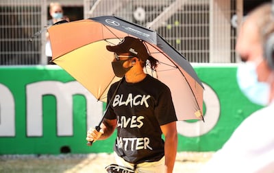 BARCELONA, SPAIN - AUGUST 16: Lewis Hamilton of Great Britain and Mercedes GP is seen on the grid wearing a 'Black Lives Matter' t-shirt prior to the F1 Grand Prix of Spain at Circuit de Barcelona-Catalunya on August 16, 2020 in Barcelona, Spain. (Photo by Albert Gea/Pool via Getty Images)