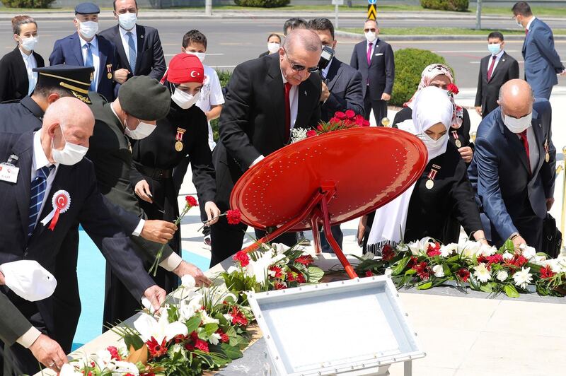 Turkish President Recep Tayyip Erdogan lays a wrest of flowers at the July 15 Monument, in Ankara, on July 15, 2020. AFP