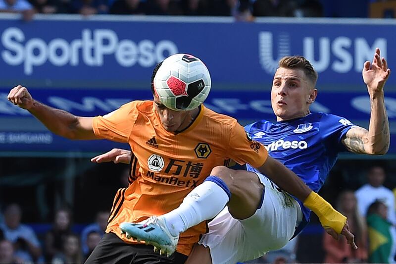 Wolverhampton Wanderers' Mexican striker Raul Jimenez receives a kick in the face from Everton's French defender Lucas Digne. AFP