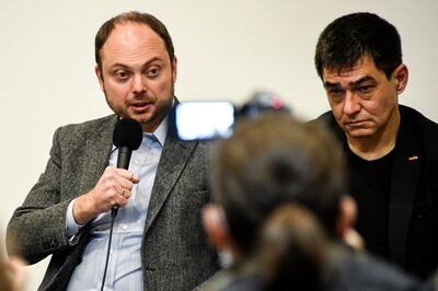 Russian journalist and activist Vladimir Kara-Murza, left, and Russian activist Sergei Davidis attend a conference of Russian rights group Memorial in Moscow on October 27, 2021. AFP