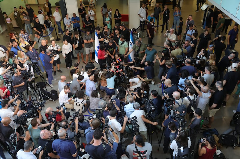 Yocheved Lifshitz speaks to the media outside a Tel Aviv hospital after being released by Hamas. EPA