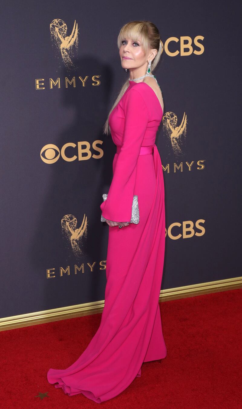 Jane Fonda, in pink Brandon Maxwell, arrives for the 69th annual Primetime Emmy Awards ceremony held at the Microsoft Theatre in Los Angeles, California, on September 17, 2017