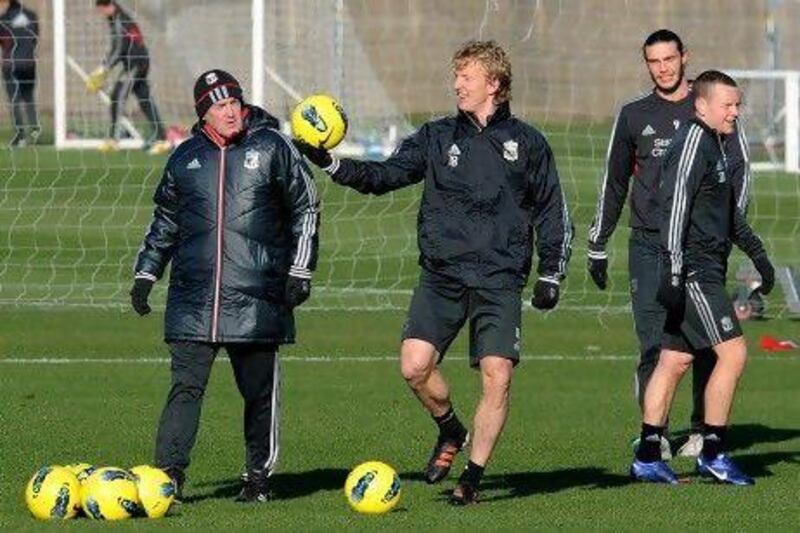 Kenny Dalglish, left, has seen his side draw seven  of their 11 league games at Anfield this season.