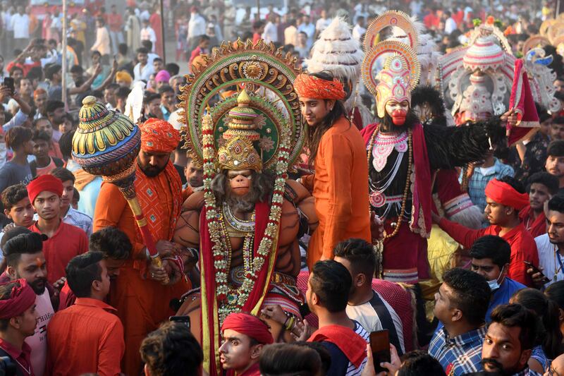 Hindu devotees, dressed up as deities, take part in a religious procession on the grounds of the Durgiana Temple in Amritsar. AFP