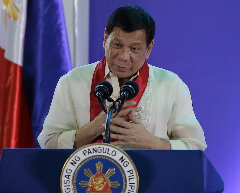 Philippine President Rodrigo Duterte speaks during the 113th Founding Anniversary of the Bureau of Internal Revenue in metropolitan Manila, Wednesday Aug. 2, 2017. The tough-talking Duterte briefly lashed out at North Korean leader Kim Jong Un in a speech before local revenue collectors Wednesday. (AP Photo/Aaron Favila)