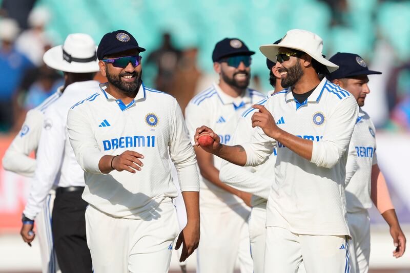 India's captain Rohit Sharma, left, and Ravindra Jadeja celebrate victory in Rajkot. AP