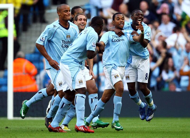 MANCHESTER, UNITED KINGDOM - SEPTEMBER 13:  Robinho of Manchester is mobbed by team mates after scoring the first goal of the game during the Barclays Premier League match between Manchester City and Chelsea at The City of Manchester Stadium on September 13, 2008 in Manchester, England.  (Photo by Alex Livesey/Getty Images)