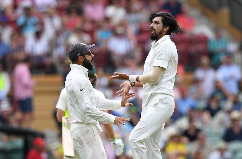 India's captain Virat Kohli (L) celebrates with his teammate Ishant Sharma after the dismissal of Australia's captain Tim Paine for 5 runs on day two of the first test match between Australia and India at the Adelaide Oval in Adelaide, Australia, December 7, 2018. AAP/Dave Hunt/via REUTERS  ATTENTION EDITORS - THIS IMAGE WAS PROVIDED BY A THIRD PARTY. NO RESALES. NO ARCHIVE. AUSTRALIA OUT. NEW ZEALAND OUT.